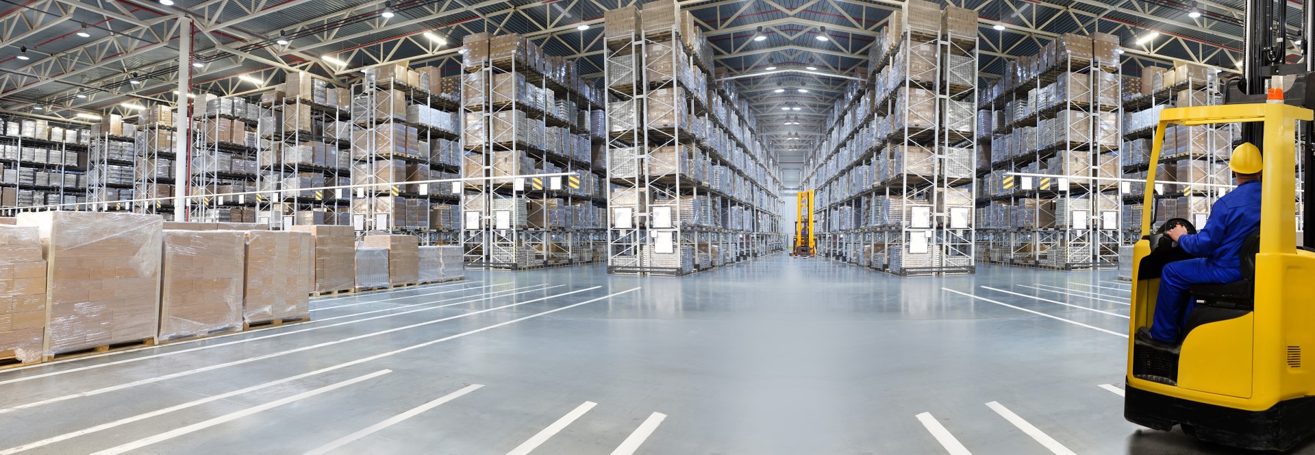 Large warehouse with forklift truck