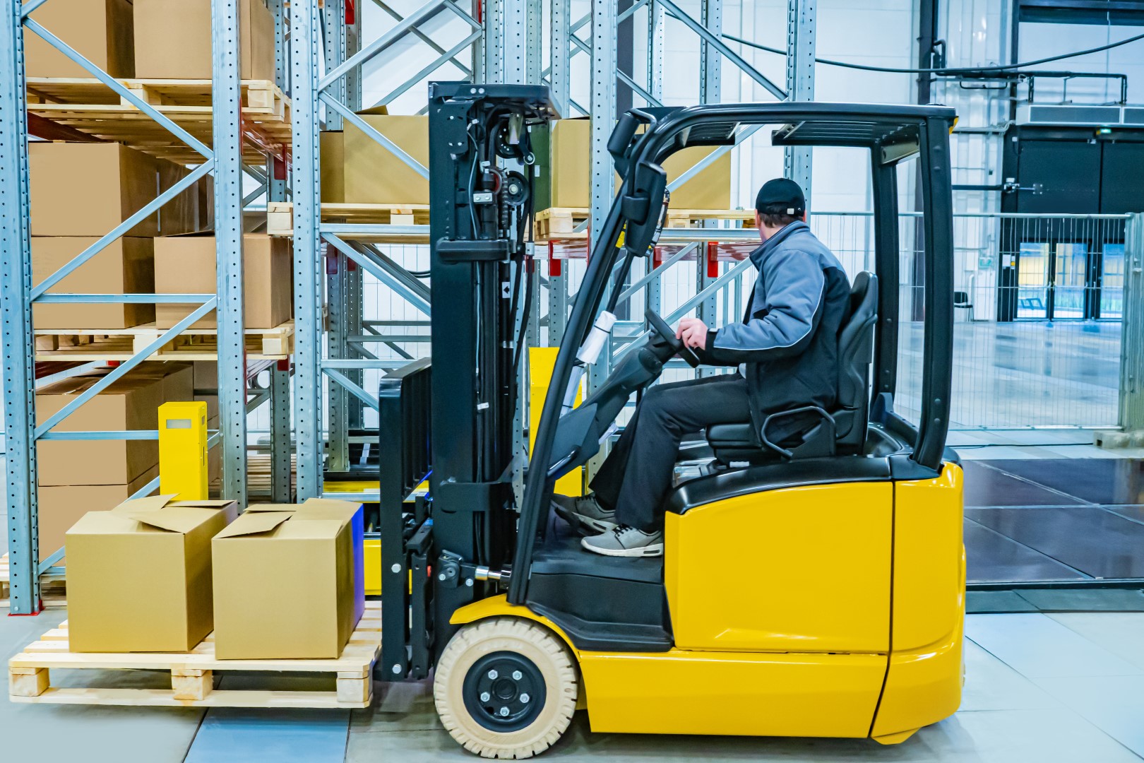 Forklift driver moving pallet