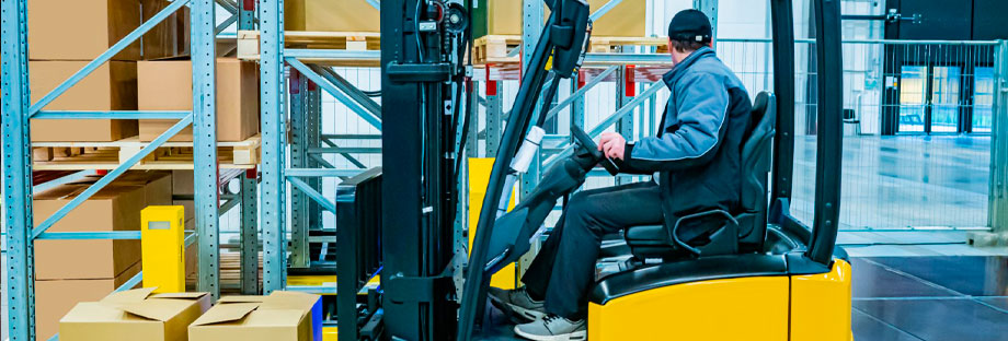 Forklift driver moving pallet